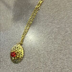 Gold Filigree Pendant Necklace with Red Accent